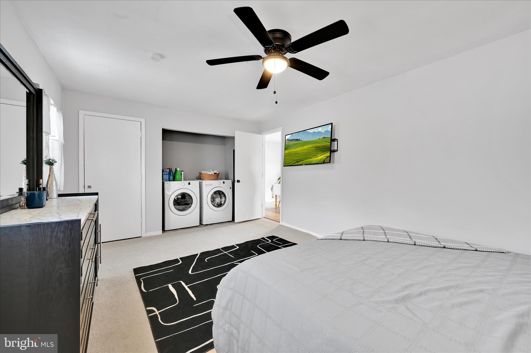 1428 Meade Street Reading, PA 19607 - Photo 21 of 29 a bedroom with a bed and a chandelier