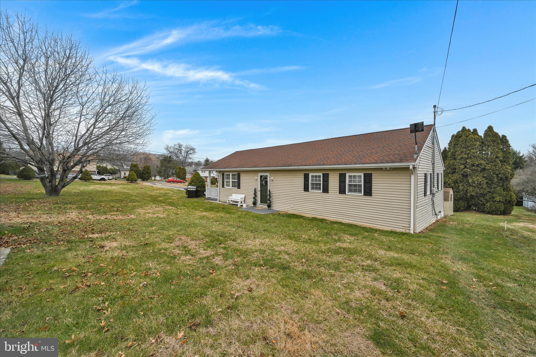 1428 Meade Street Reading, PA 19607 - Photo 27 of 29 a house that is sitting in the grass with large trees