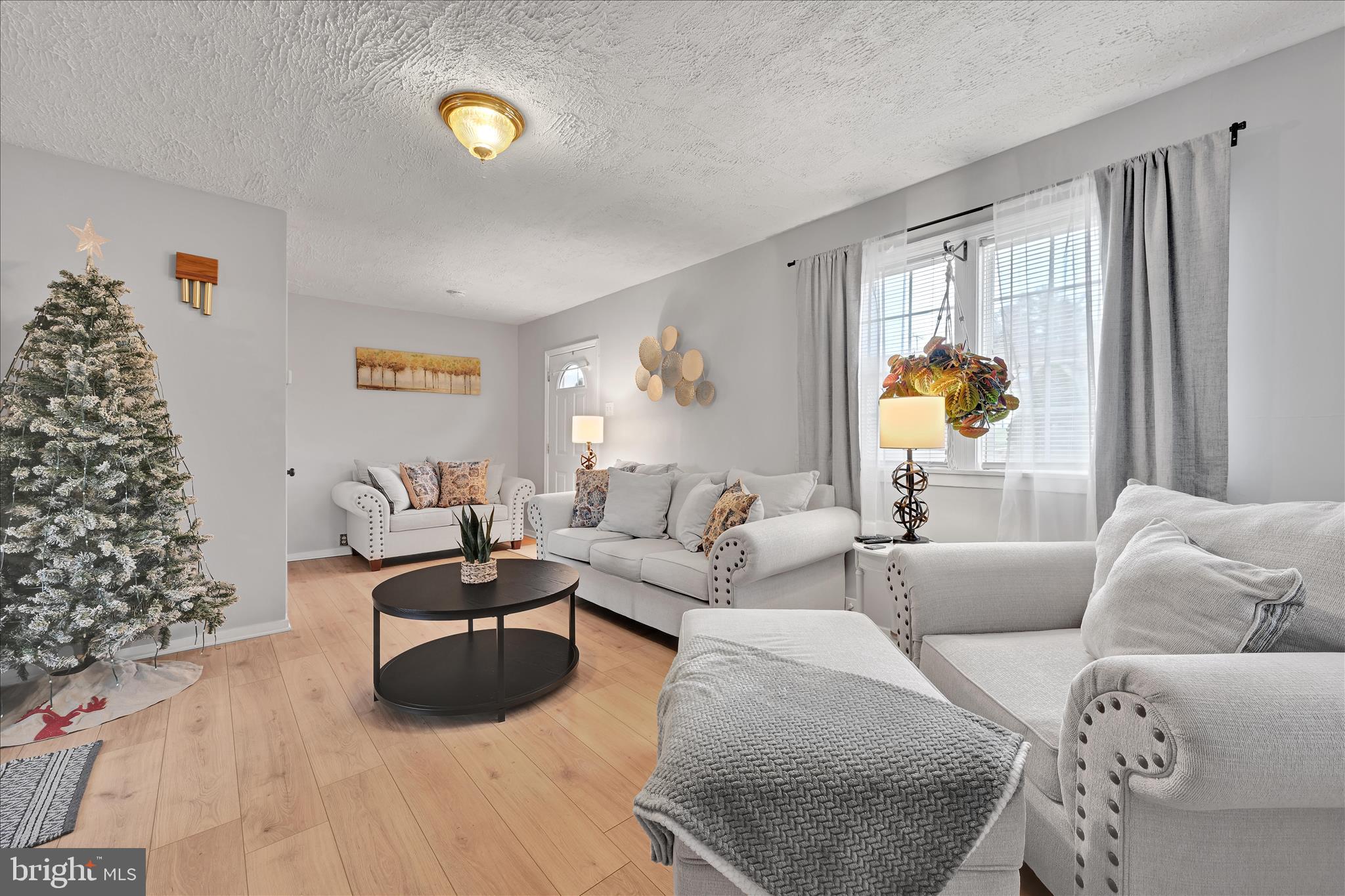 1428 Meade Street Reading, PA 19607 - Photo 10 of 29 a living room with furniture and a large window
