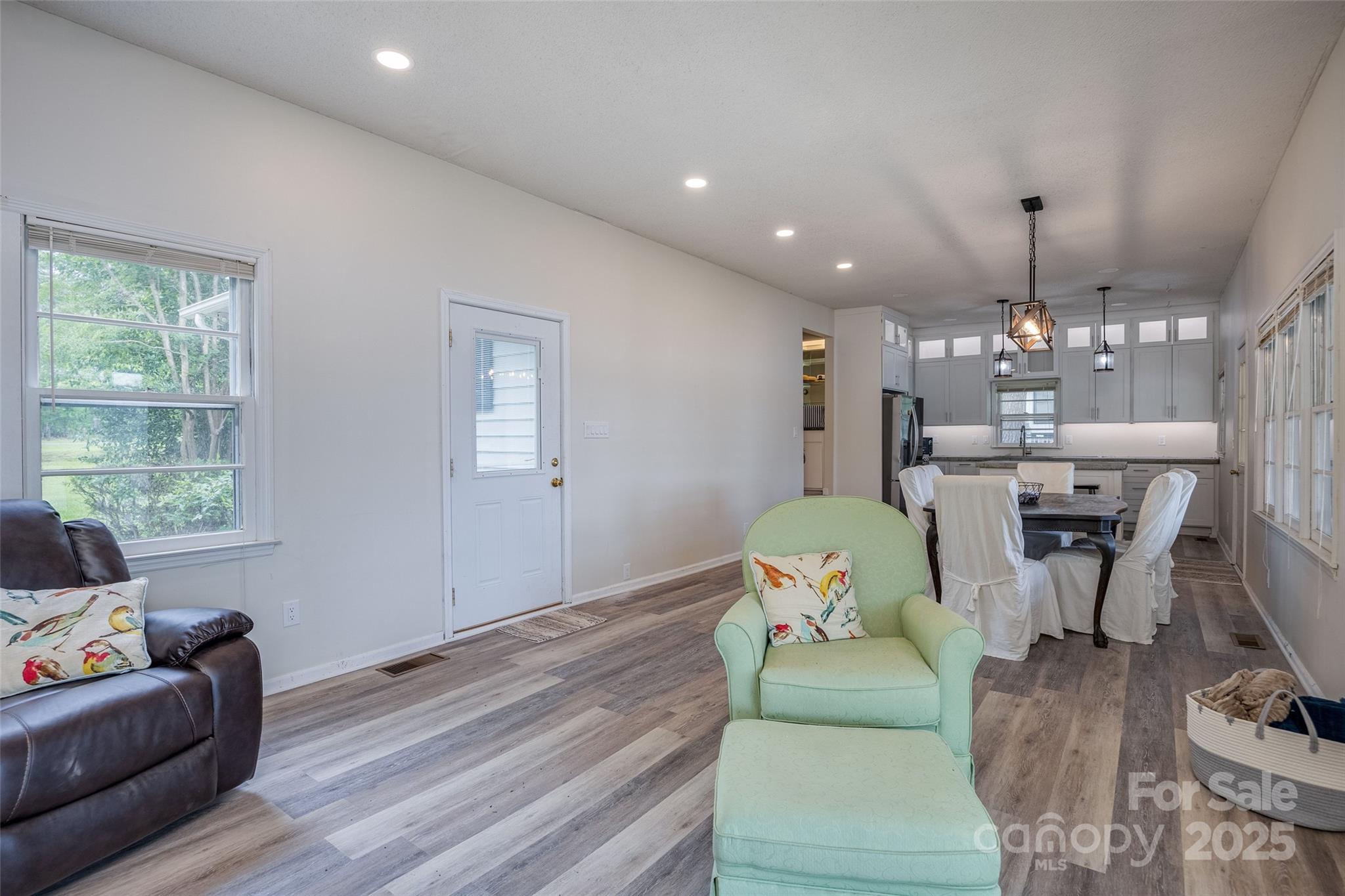 1805 Lake Shore Road Camden, SC 29020 - Photo 11 of 48 a living room with furniture and a chandelier