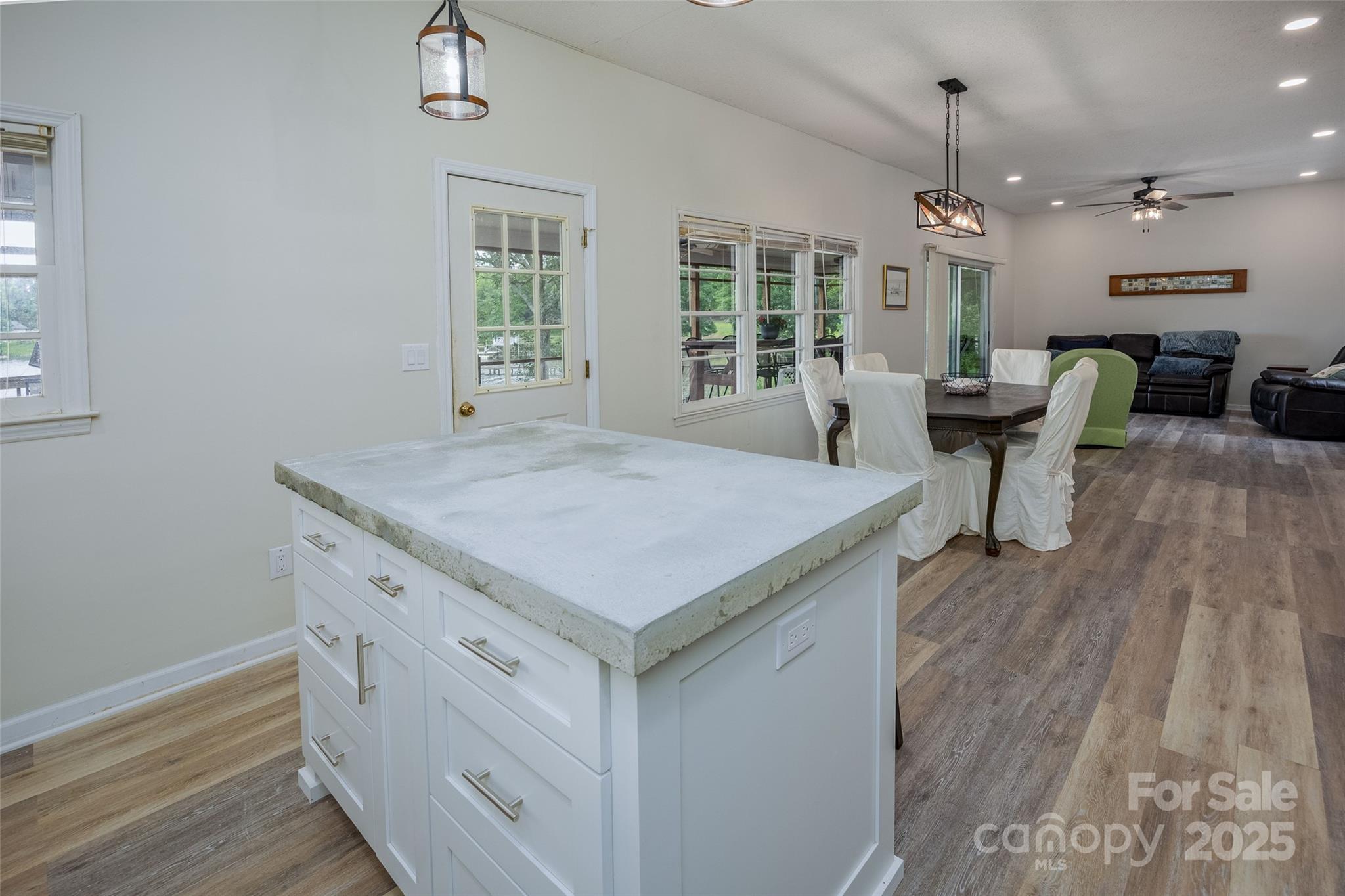 1805 Lake Shore Road Camden, SC 29020 - Photo 21 of 48 an open kitchen with a table and chairs