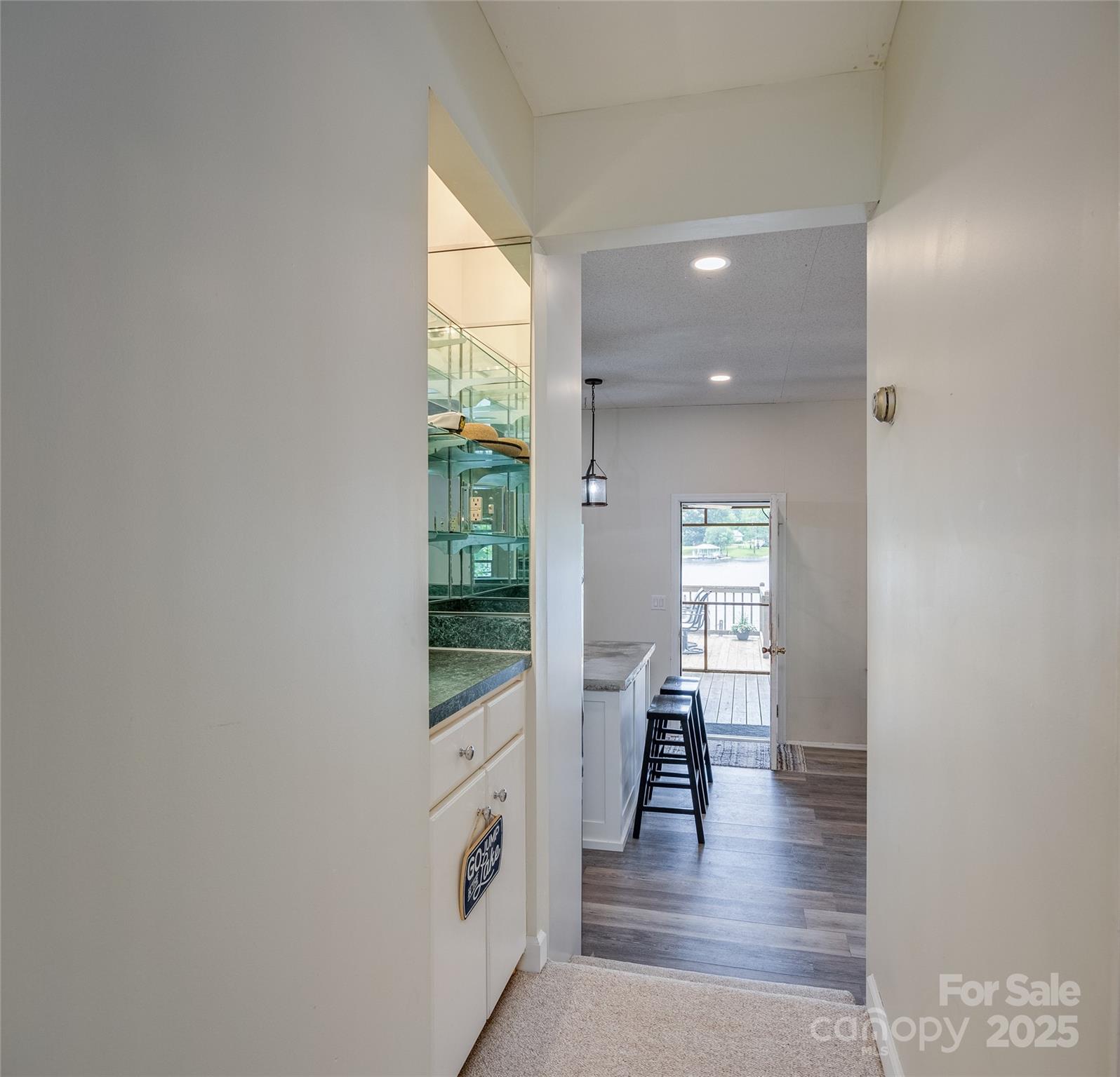1805 Lake Shore Road Camden, SC 29020 - Photo 22 of 48 a view of a hallway with wooden floor and a living room