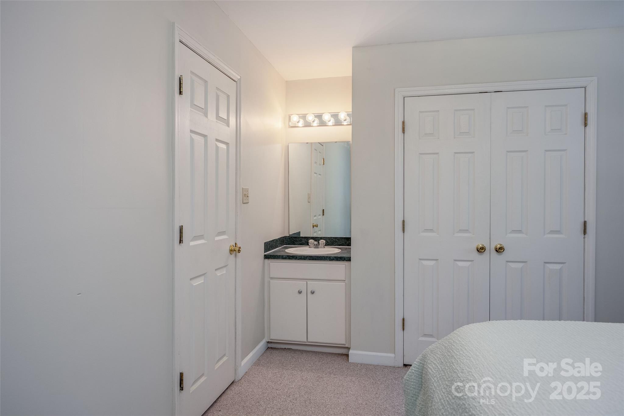1805 Lake Shore Road Camden, SC 29020 - Photo 25 of 48 a spacious bathroom with a granite countertop sink and a mirror