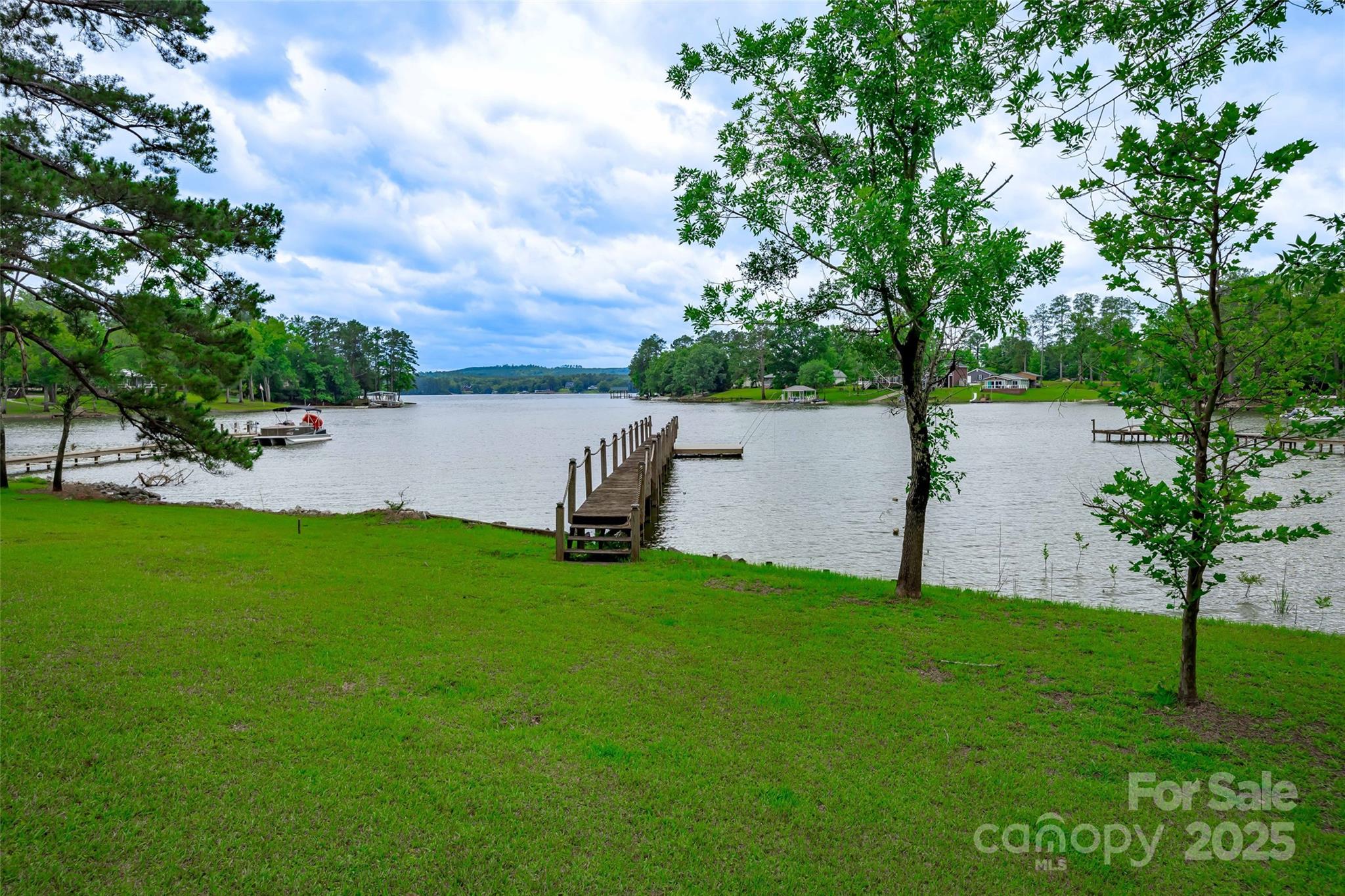 1805 Lake Shore Road Camden, SC 29020 - Photo 42 of 48 a view of a garden with a bench