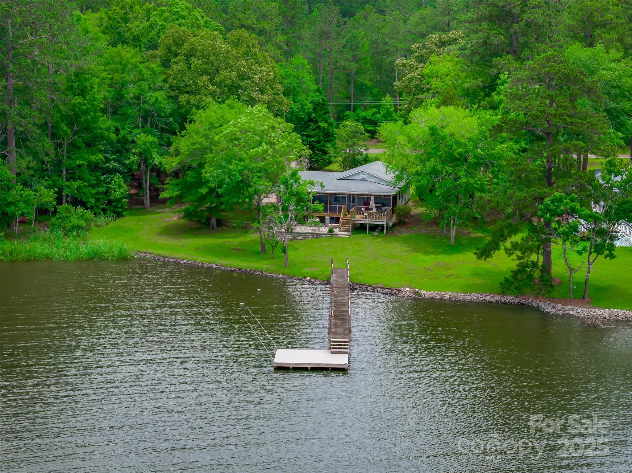 1805 Lake Shore Road Camden, SC 29020 - Photo 48 of 48 a view of a lake with a house in the background