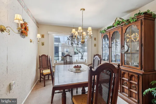 a view of a dining room with furniture and chandelier kitchen