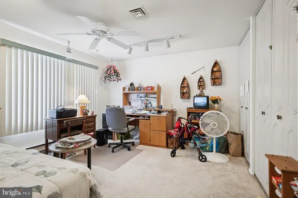 a bedroom with a bed and furniture