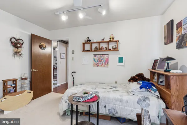 a bedroom that has a bed and a chair in it