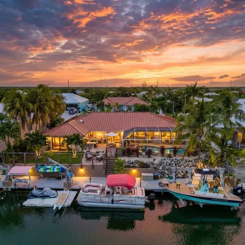 a view of a lake with cars parked