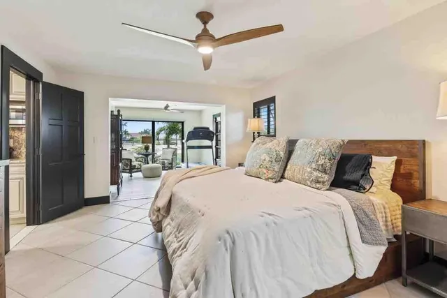a living room with furniture and a book shelf