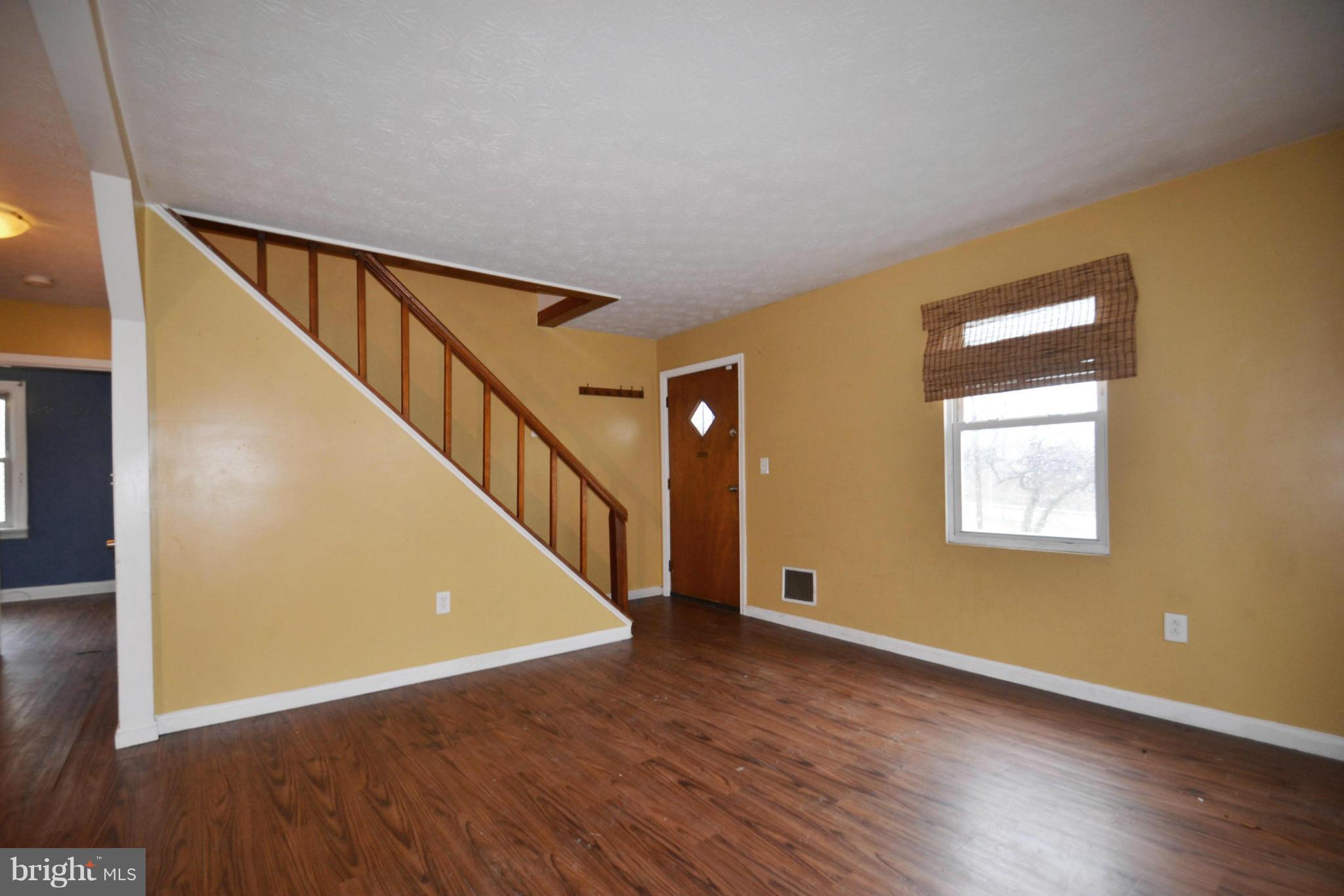 3211 Rosalie Road Baltimore, MD 21227 - Photo 11 of 25 a view of an entryway with wooden floor