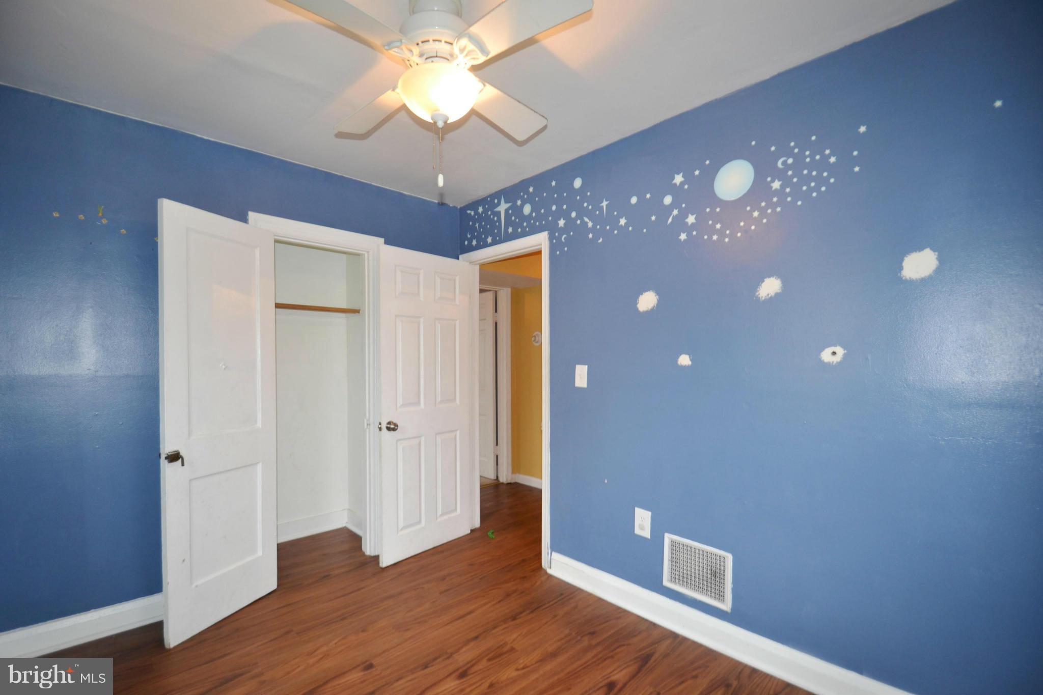 3211 Rosalie Road Baltimore, MD 21227 - Photo 16 of 25 a view of livingroom with hardwood floor and ceiling fan