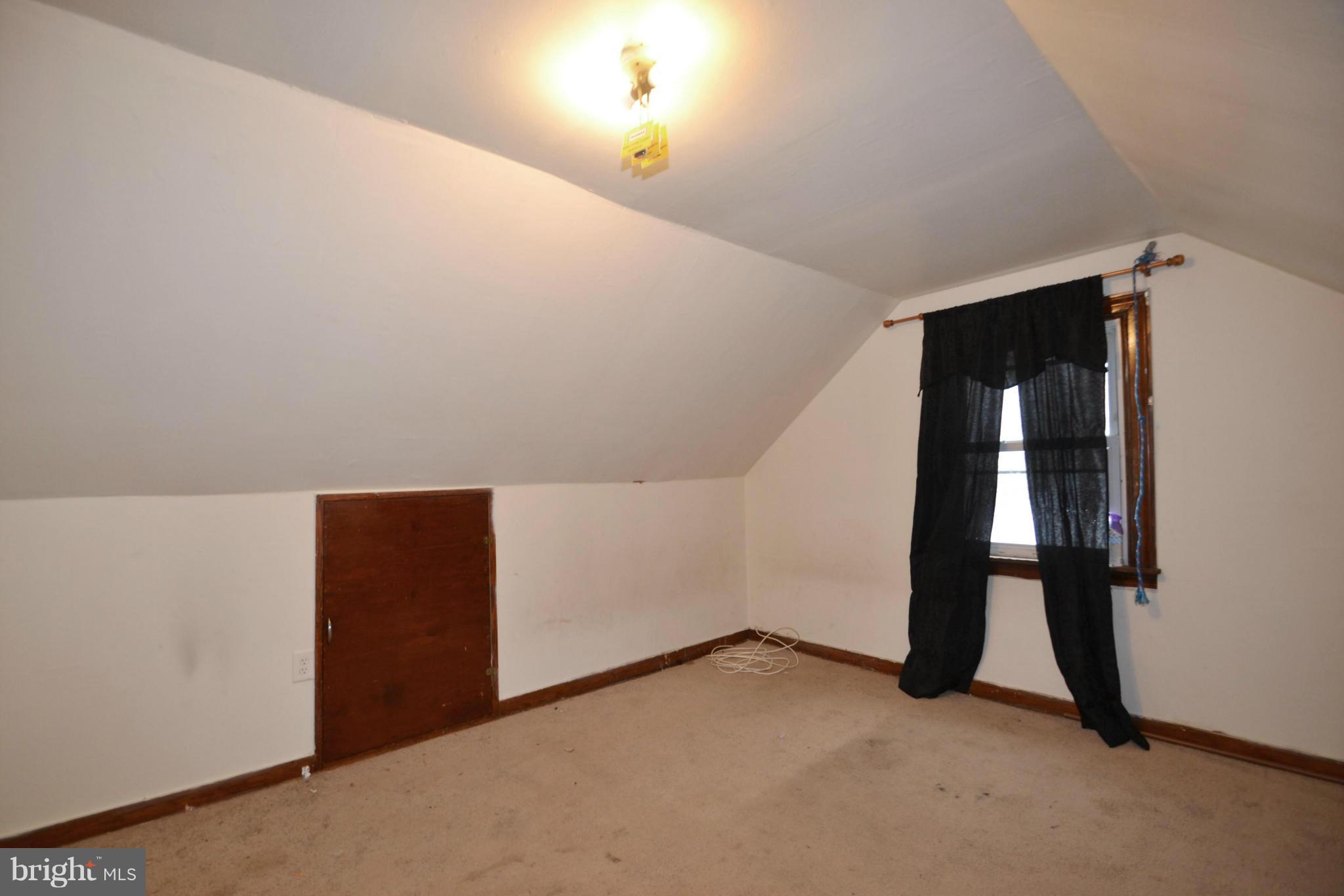3211 Rosalie Road Baltimore, MD 21227 - Photo 18 of 25 wooden floor in an empty room with a window