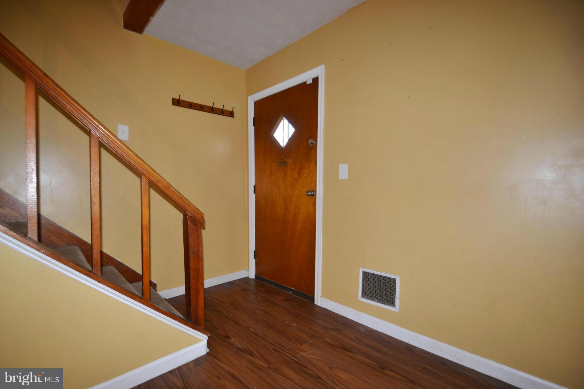 3211 Rosalie Road Baltimore, MD 21227 - Photo 3 of 25 a view of an entryway with wooden floor