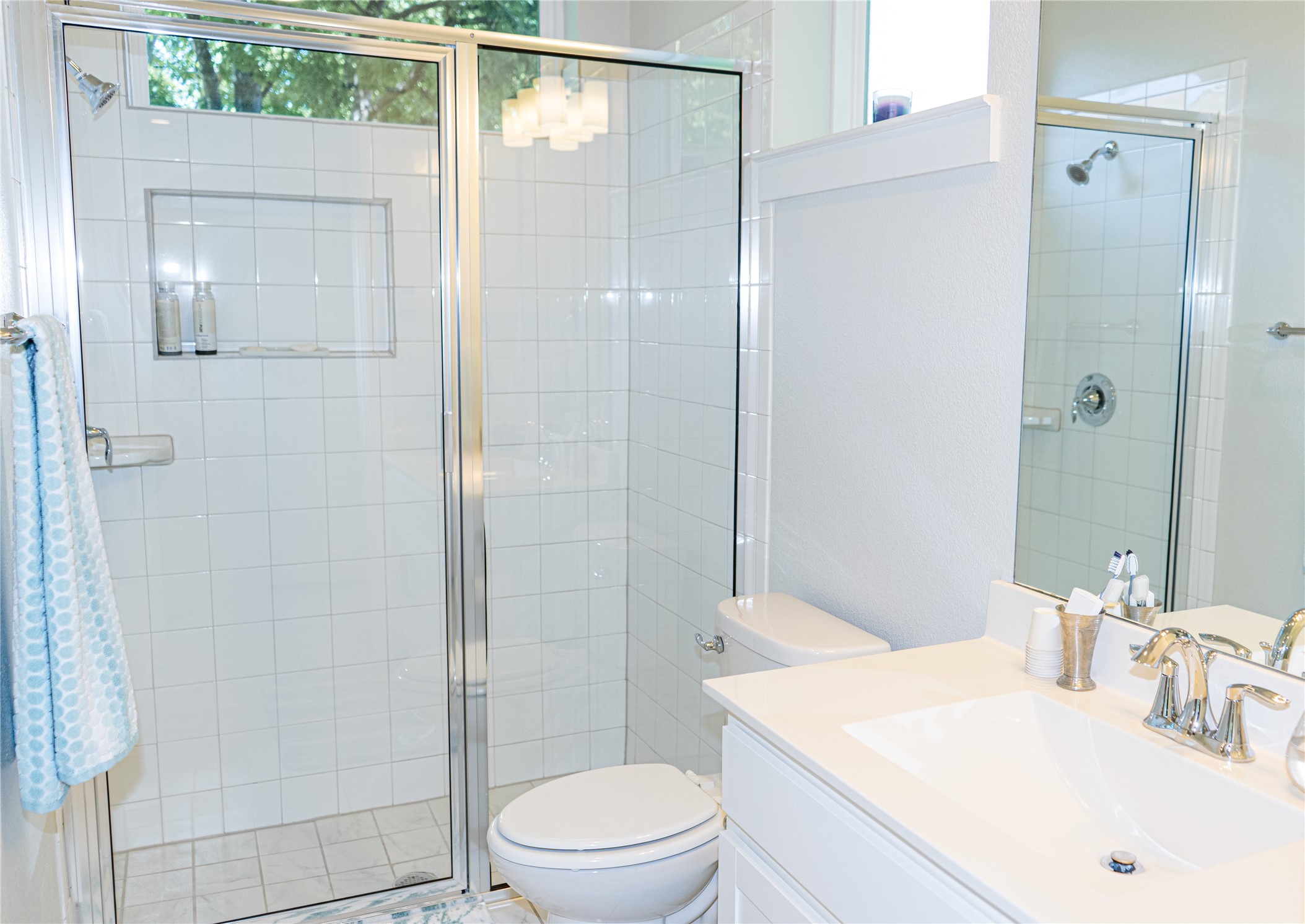 2714 East 3rd Street, Unit 2 Austin, TX 78702 - Photo 7 of 13 a bathroom with a sink a toilet and shower
