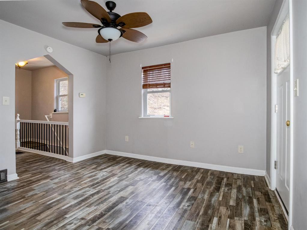 116 Riverview Avenue Aliquippa, PA 15001 - Photo 11 of 28 wooden floor in an empty room with a window