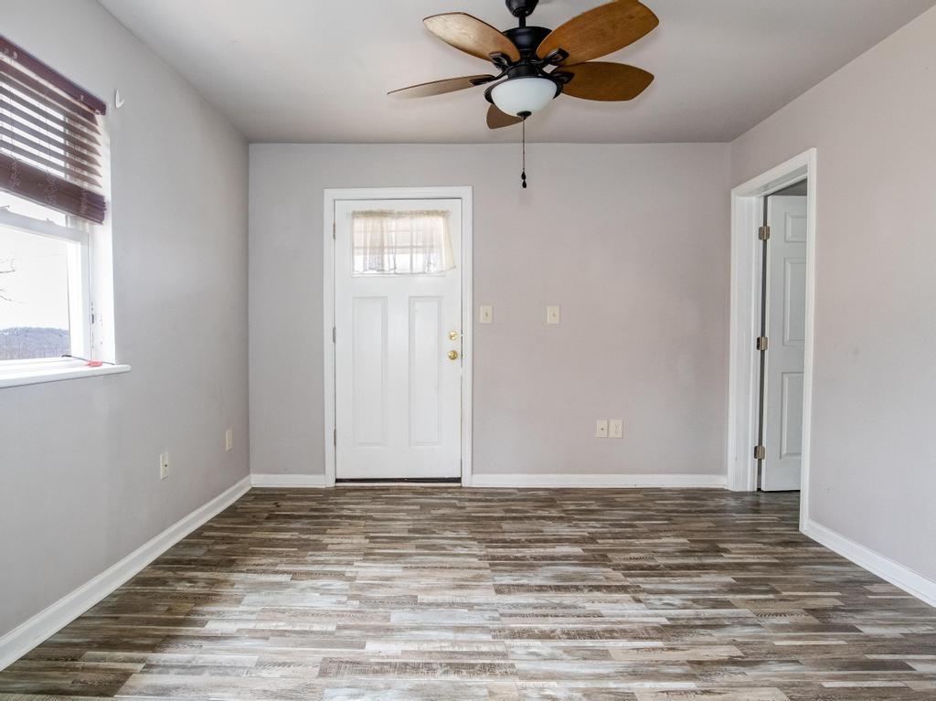 116 Riverview Avenue Aliquippa, PA 15001 - Photo 12 of 28 a view of an empty room with wooden floor and a window