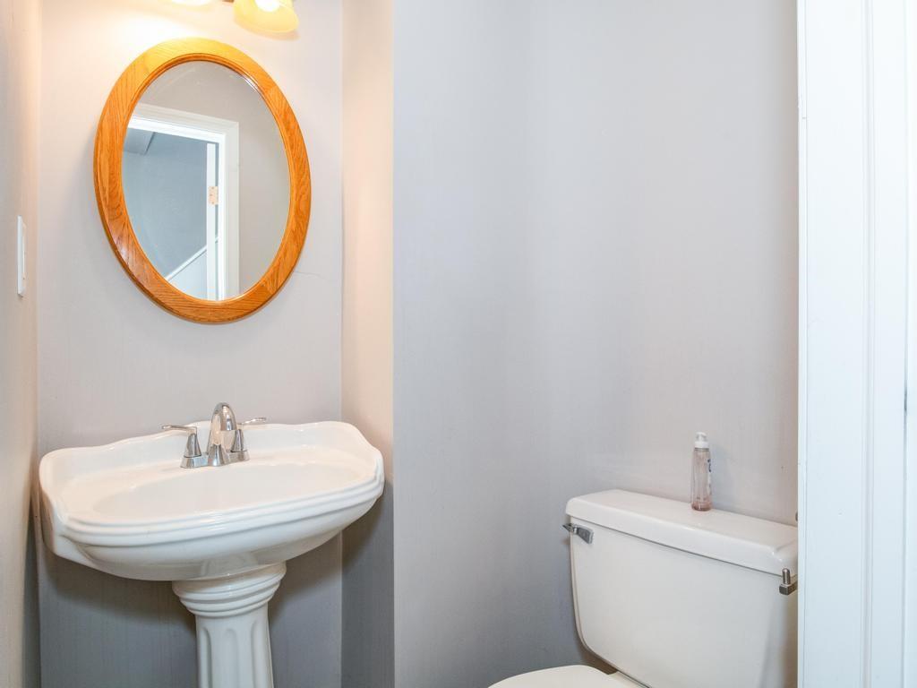 116 Riverview Avenue Aliquippa, PA 15001 - Photo 13 of 28 a bathroom with a toilet a sink and a mirror