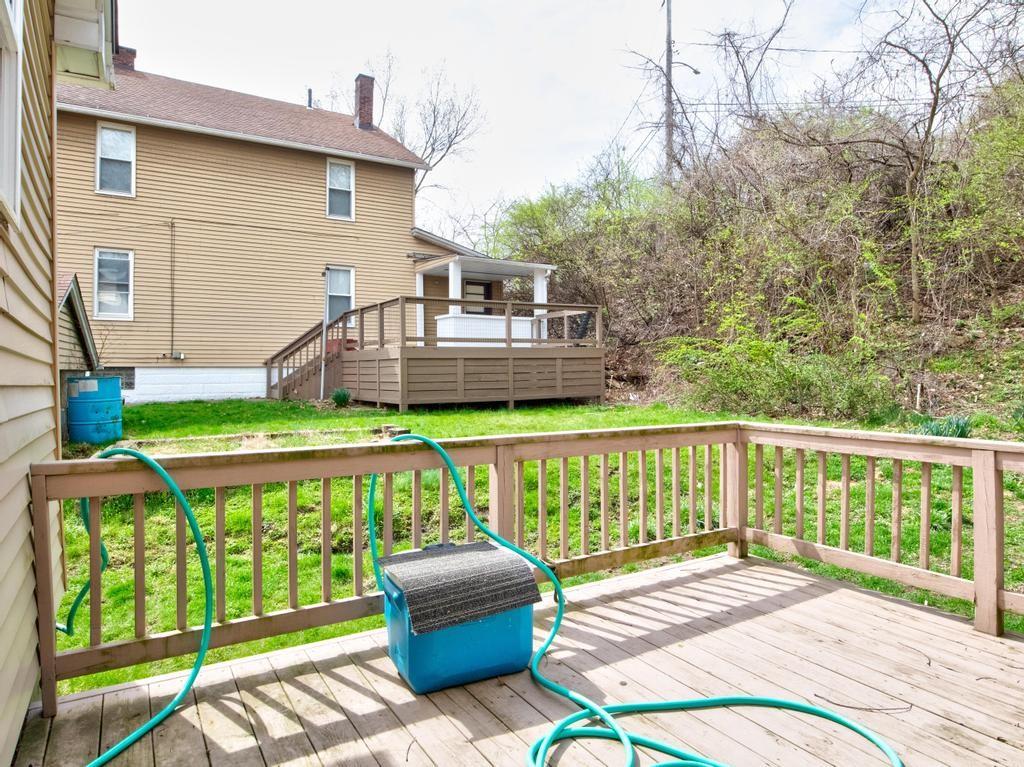 116 Riverview Avenue Aliquippa, PA 15001 - Photo 22 of 28 a view of a patio with a table chairs and a backyard