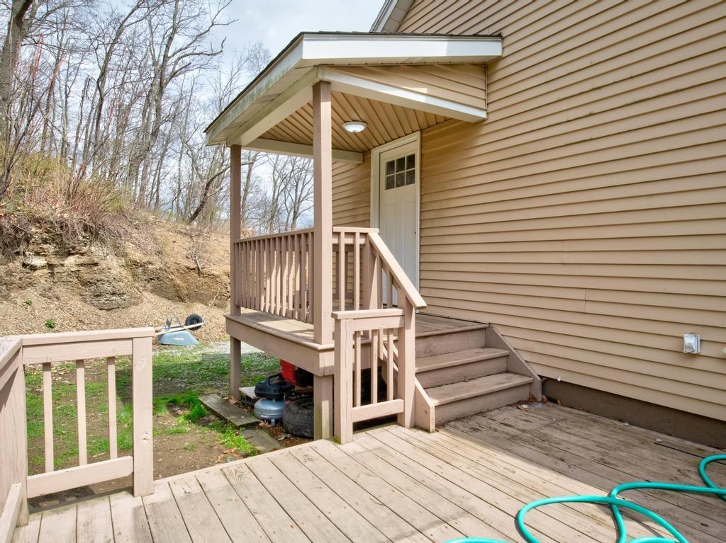 116 Riverview Avenue Aliquippa, PA 15001 - Photo 24 of 28 a view of a house with a small yard and wooden floor and fence