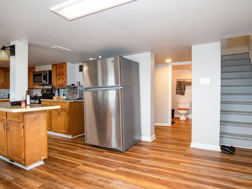 116 Riverview Avenue Aliquippa, PA 15001 - Photo 5 of 28 a kitchen with a refrigerator and a stove top oven