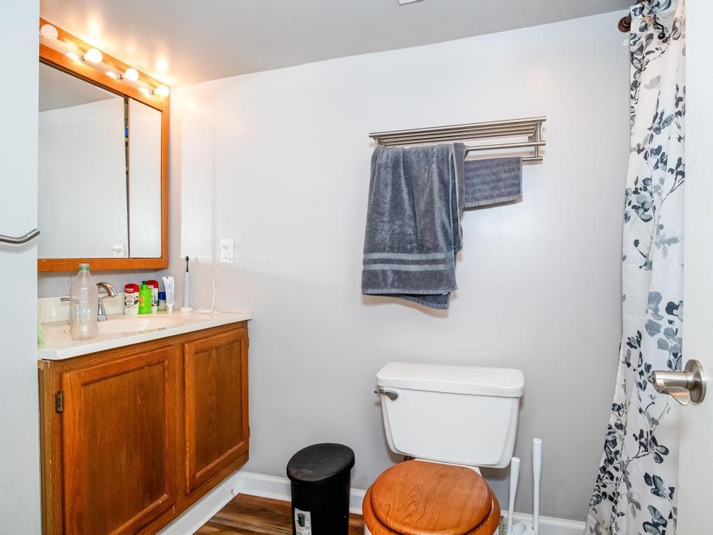 116 Riverview Avenue Aliquippa, PA 15001 - Photo 6 of 28 a bathroom with a toilet a sink and a window