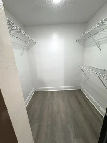 a view of an empty walk in closet