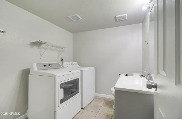 a utility room with dryer and washer