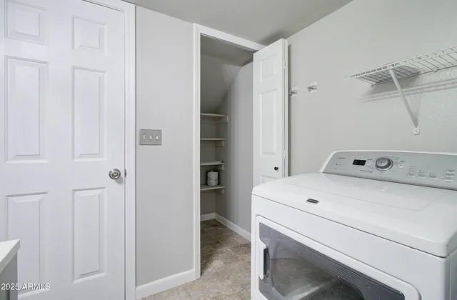a kitchen with a stove a sink and a refrigerator
