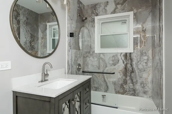 a bathroom with a sink and a mirror