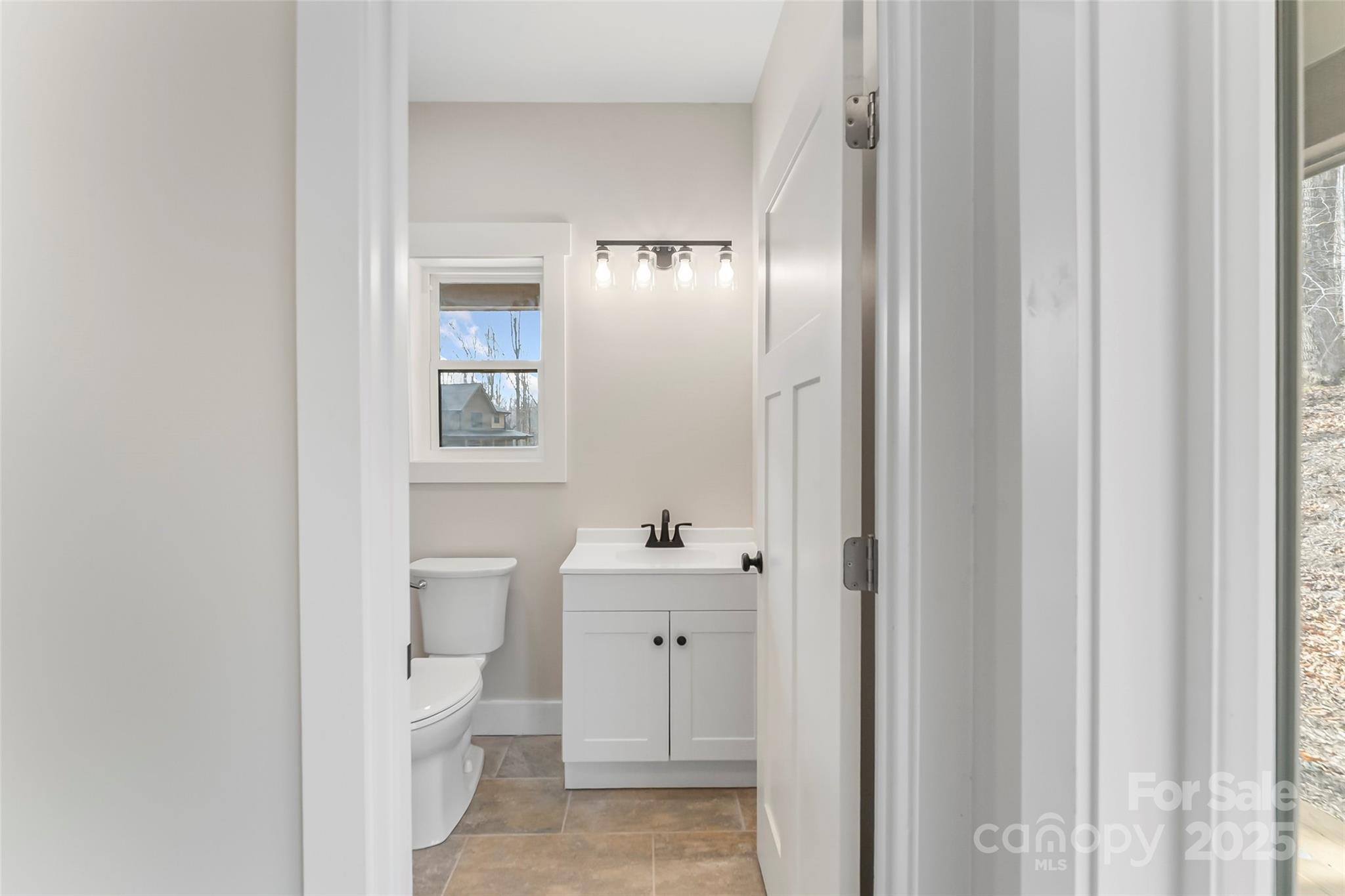 457 Blue Ridge Drive North Marion, NC 28752 - Photo 11 of 34 a bathroom with a sink and a mirror