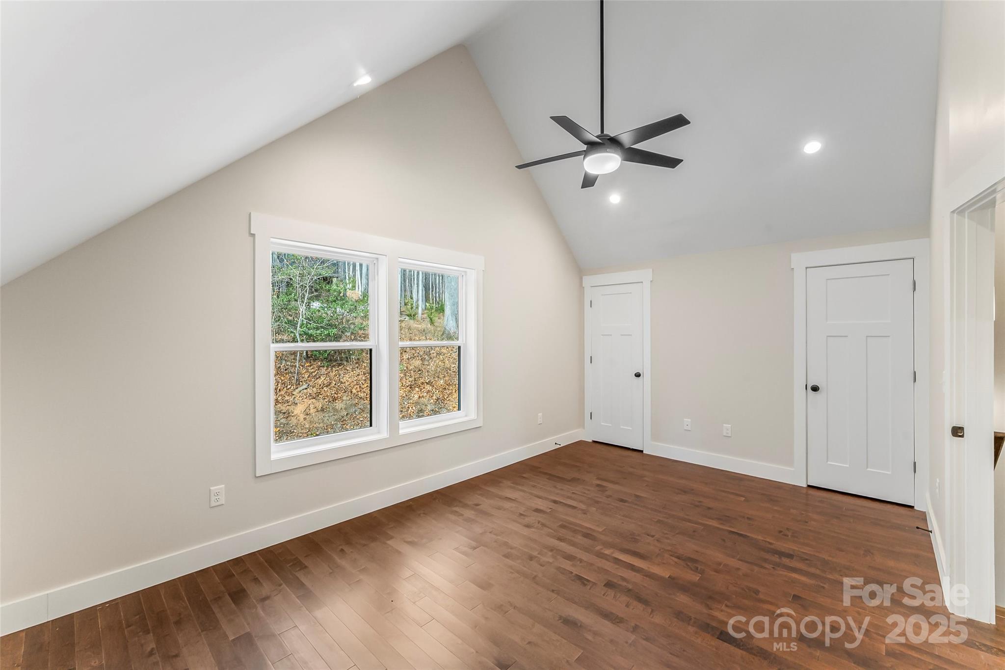 457 Blue Ridge Drive North Marion, NC 28752 - Photo 16 of 34 a view of an empty room with a window and wooden floor