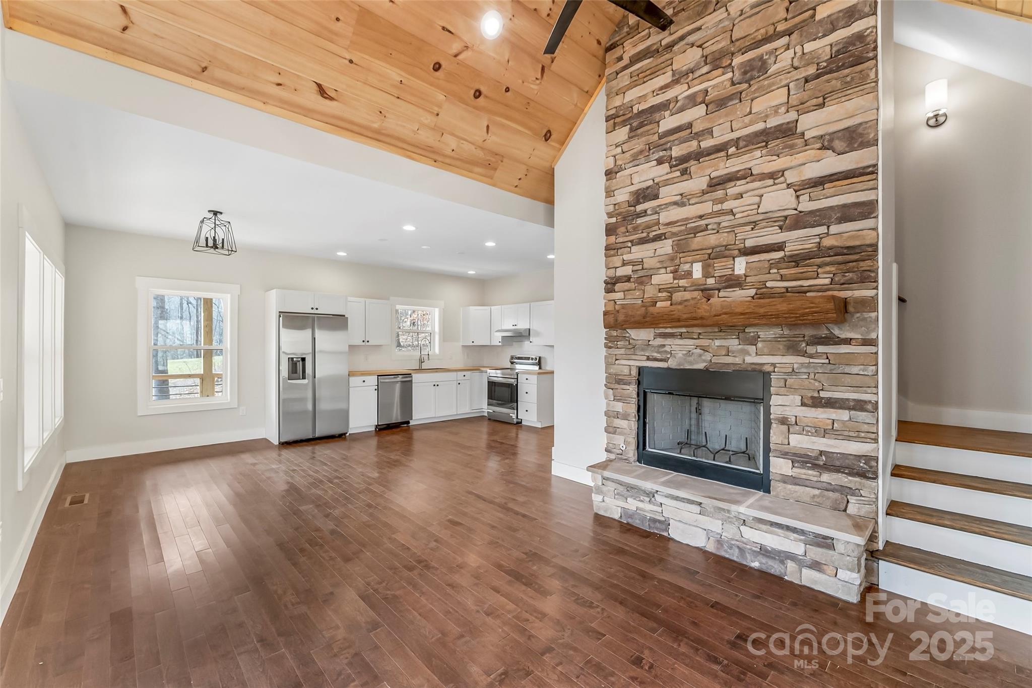 457 Blue Ridge Drive North Marion, NC 28752 - Photo 5 of 34 a view of a livingroom with wooden floor and a fireplace