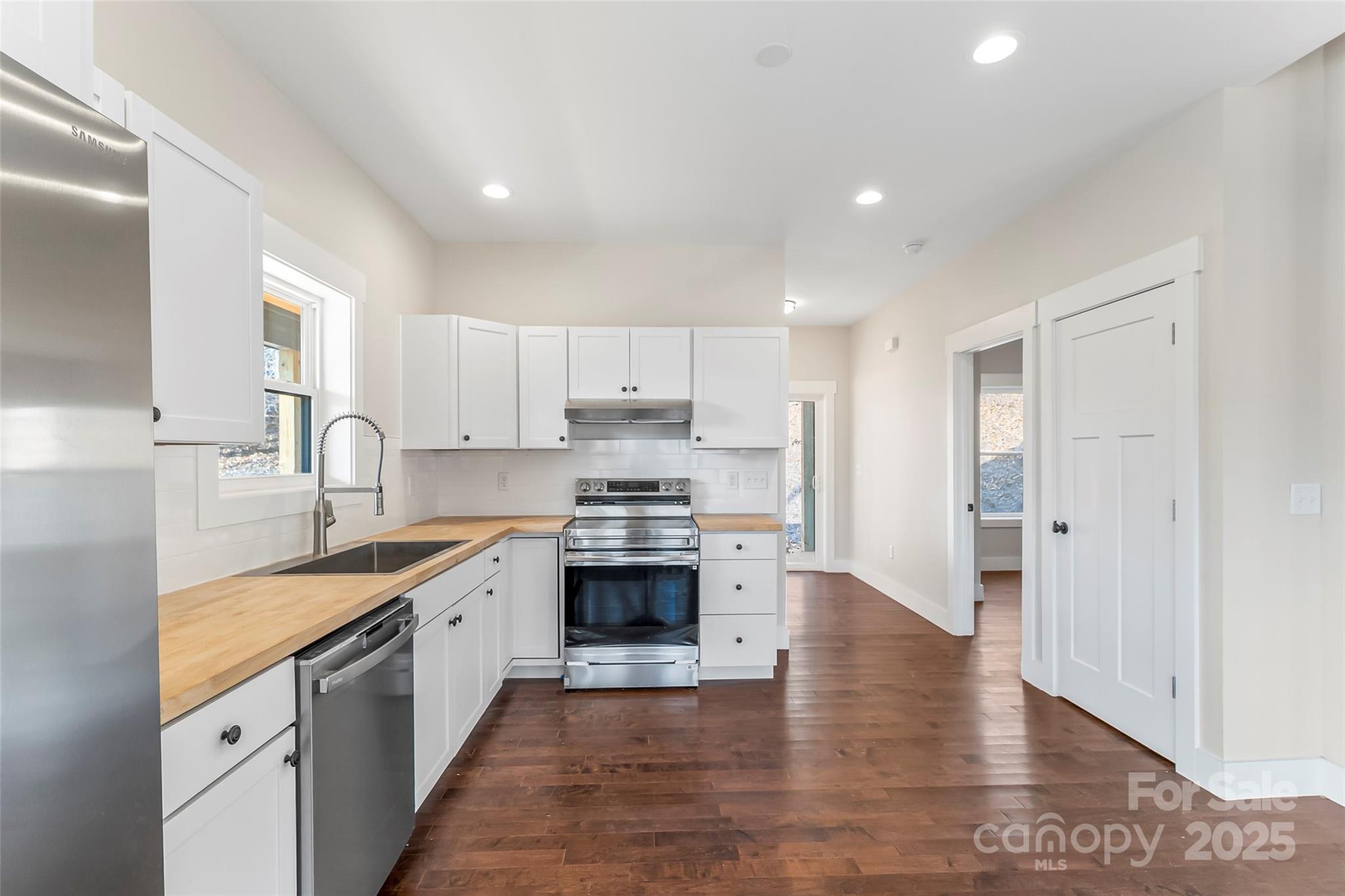 457 Blue Ridge Drive North Marion, NC 28752 - Photo 7 of 34 a large kitchen with stainless steel appliances granite countertop a sink and cabinets