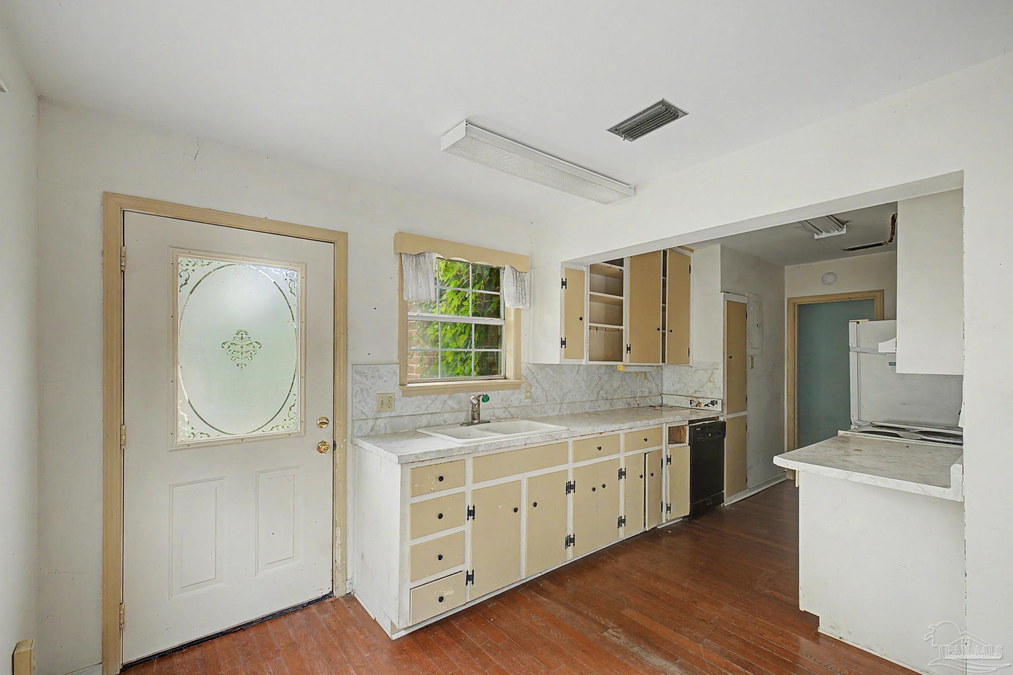 333 Gibbs Road Pensacola, FL 32507 - Photo 11 of 34 a bathroom with a granite countertop sink a mirror and a