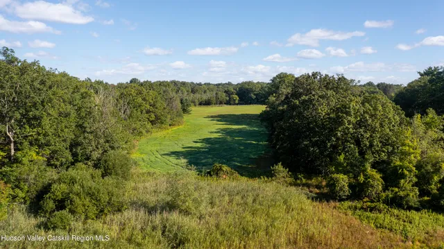 a view of a lake with a yard
