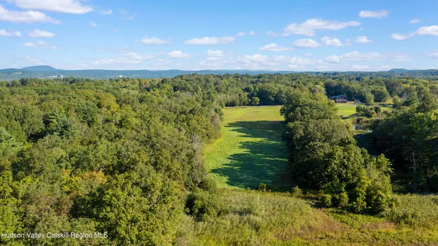 a view of a lake with a yard