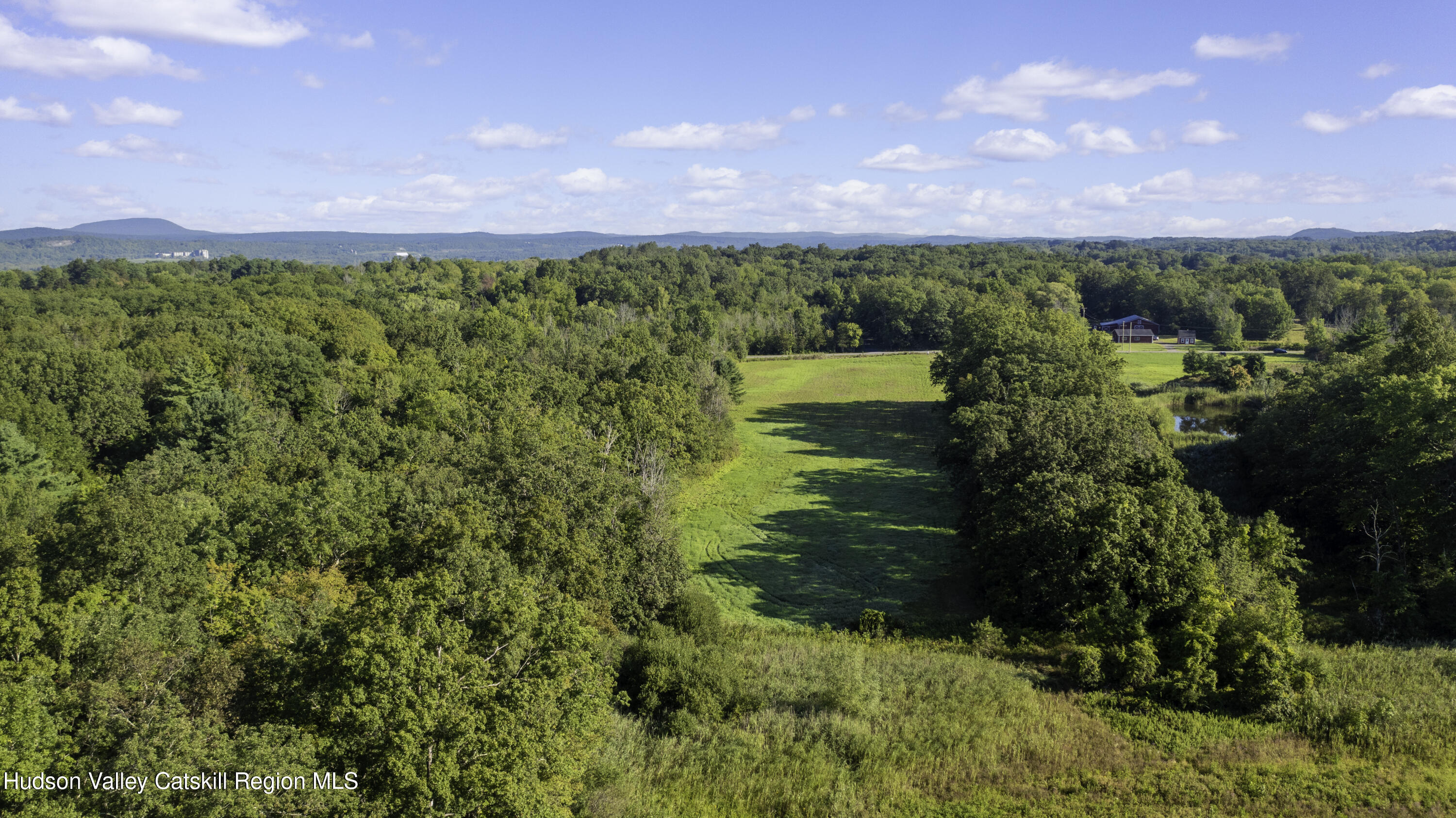 161 Roundtop Road Germantown, NY 12526 - Photo 5 of 9 a view of a lake with a yard