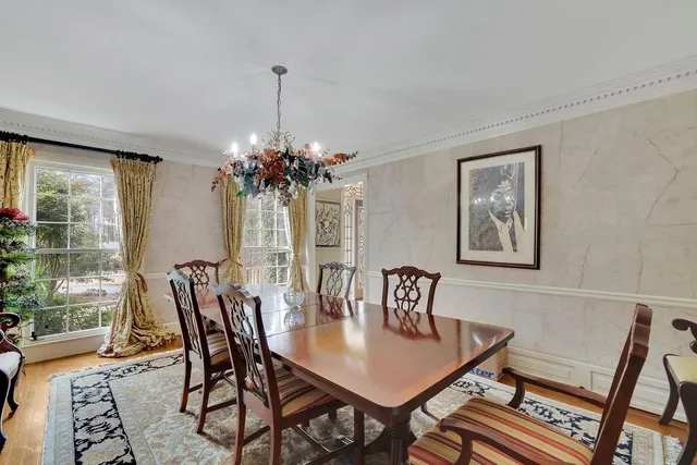 a large kitchen with granite countertop a stove sink and cabinets