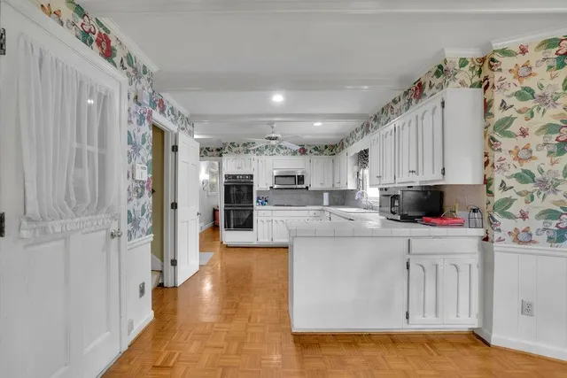 a dining room with furniture and window