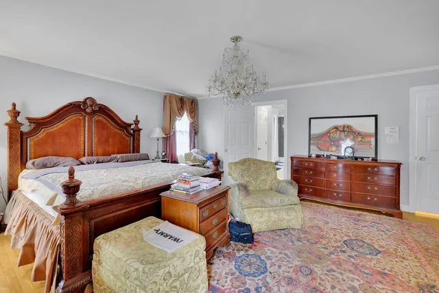 a bedroom with a bed window and couch