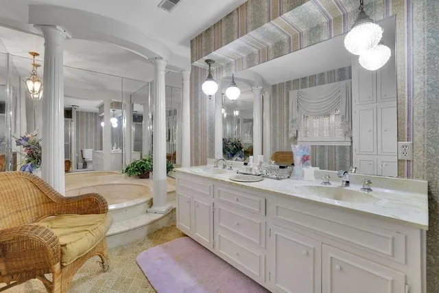 a living room with furniture and flowers