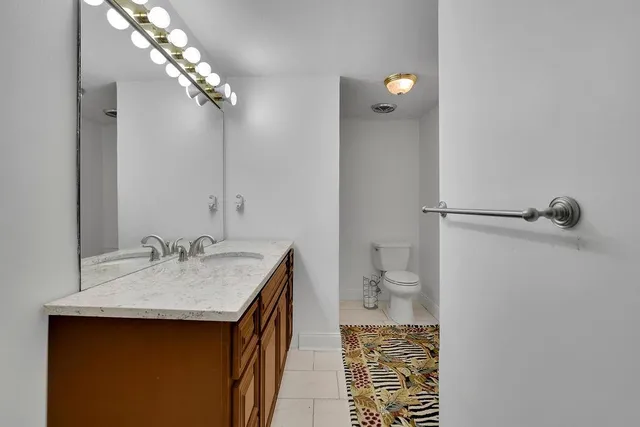 a view of a house with swimming pool and sitting area