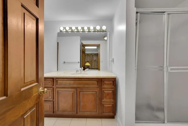 a view of a house with yard and sitting area