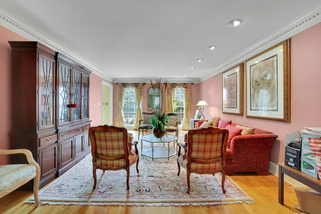 a view of a dining room with furniture and chandelier