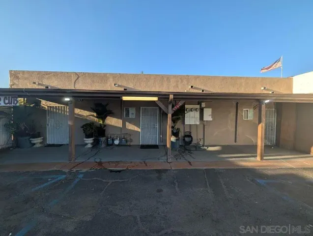 a white toilet sitting next to a bathroom sink and tub
