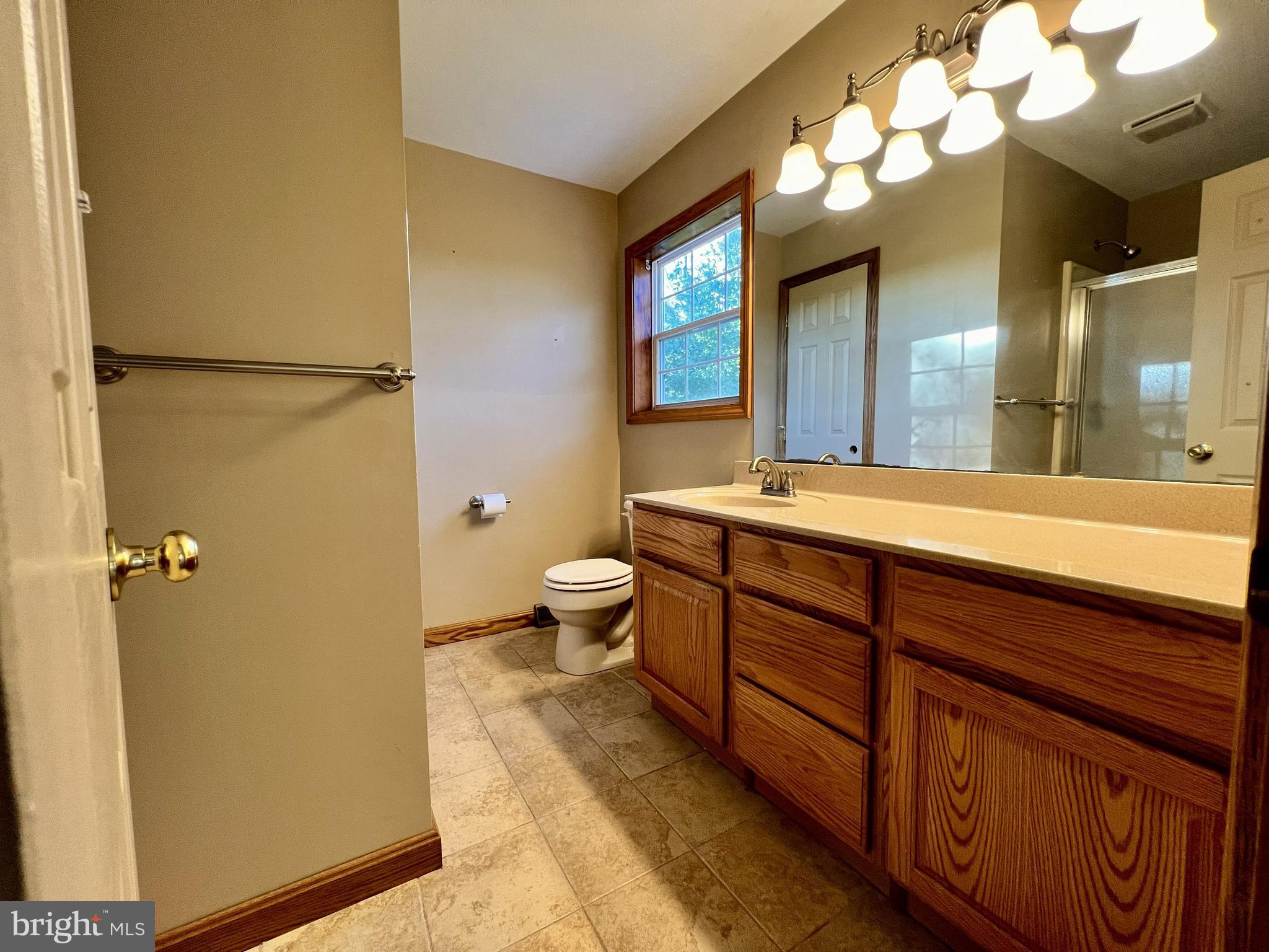 179 Sylvan Heights Road Du Bois, PA 15801 - Photo 23 of 40 a bathroom with a double vanity sink mirror and toilet