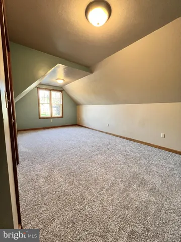 a view of a big room with windows and yard