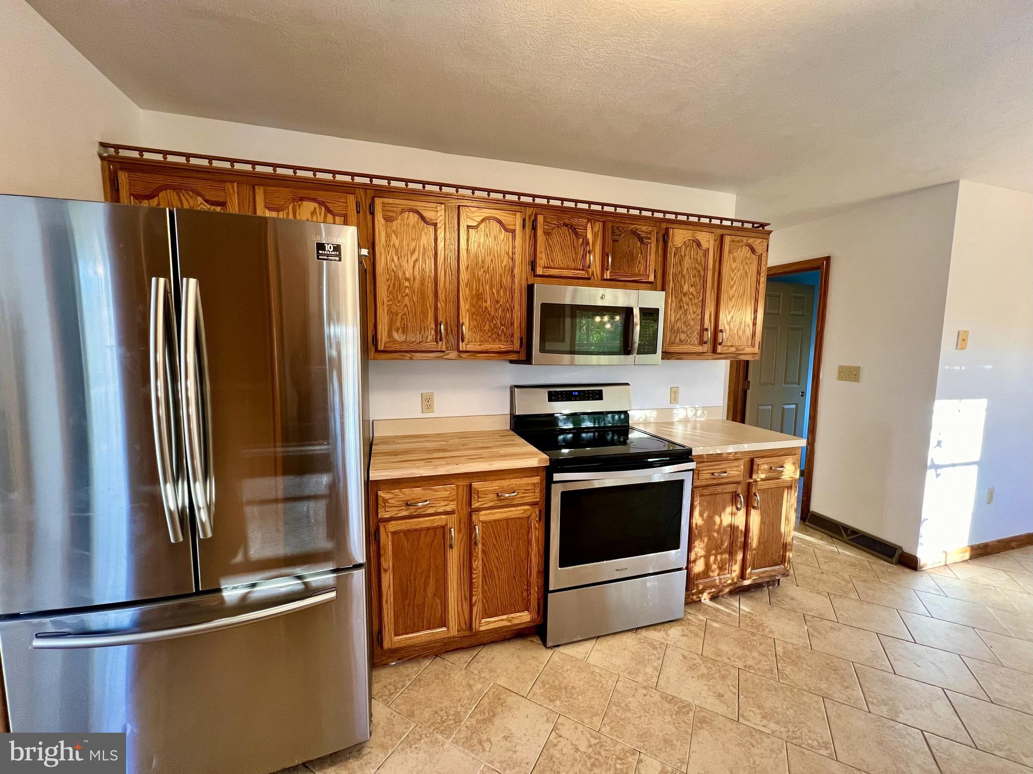 179 Sylvan Heights Road Du Bois, PA 15801 - Photo 10 of 40 a kitchen with stainless steel appliances granite countertop a refrigerator stove and microwave