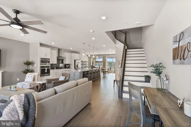 a dining room with furniture water view and wooden floor